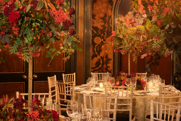 Candlelit dining tables with fine glassware, cream linen and floral centrepieces inside Rhubarb restaurant at Prestonfield Hotel Edinburgh, ideal for  large group dining and private celebrations